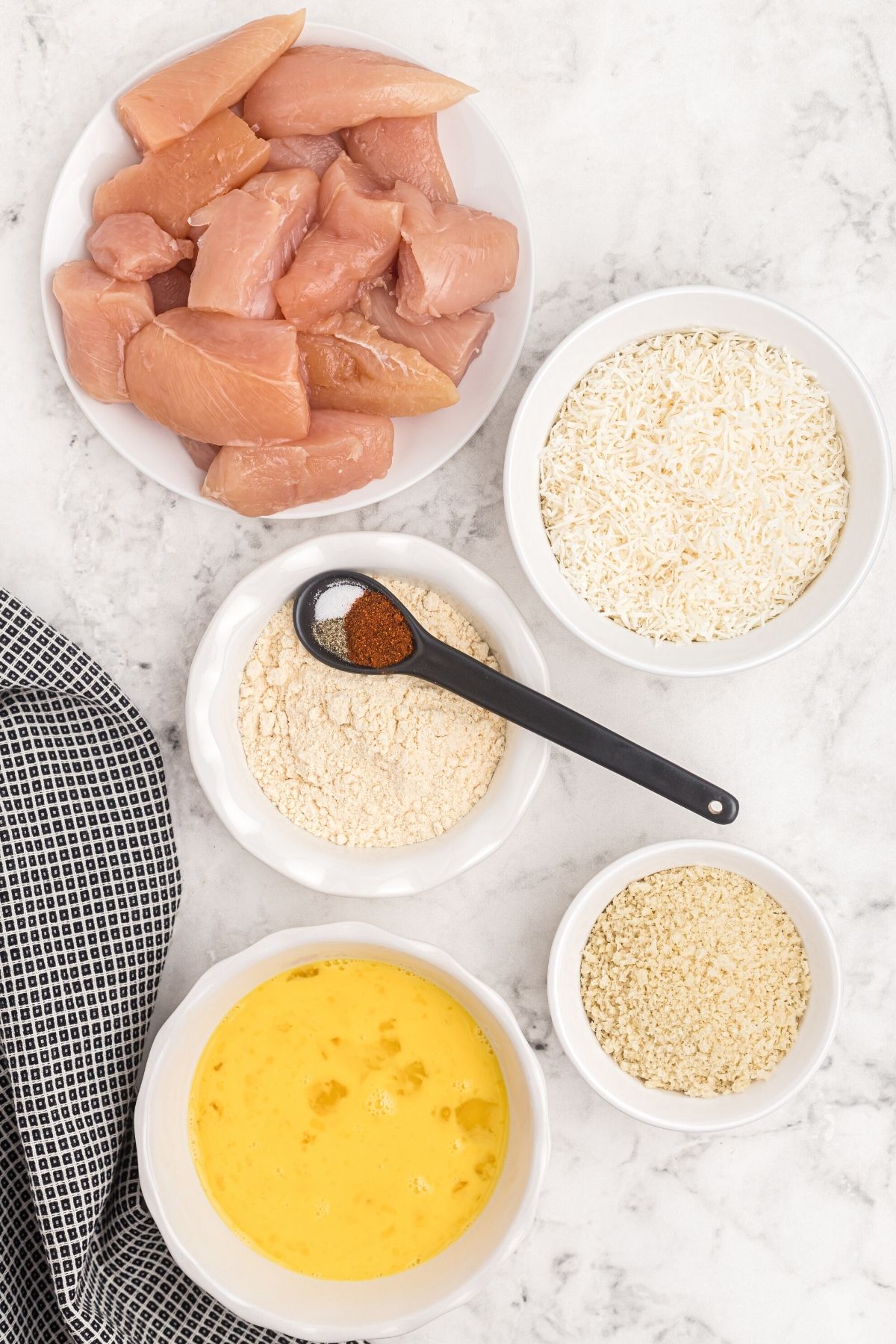 Ingredients needed to make coconut chicken measured on the table. 