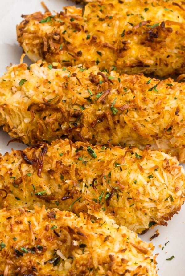 Golden crispy chicken coated with coconut flakes and parsley