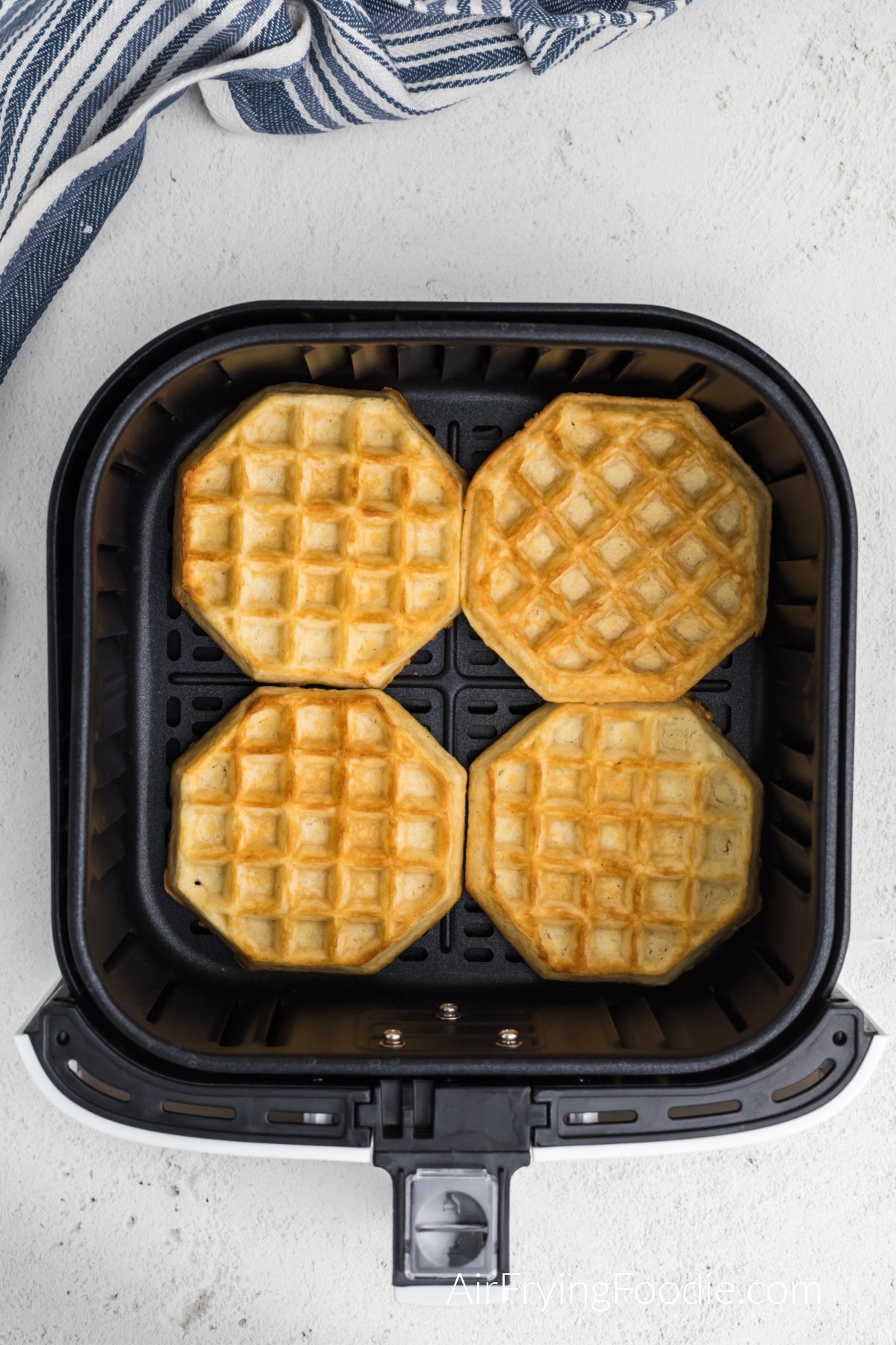 Air fried frozen waffles, fully cooked and ready to serve.