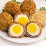 Golden brown crispy coated hard boiled eggs after being cooked in the air fryer