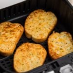 5 cheese texas toast in air fryer basket, ready to serve.