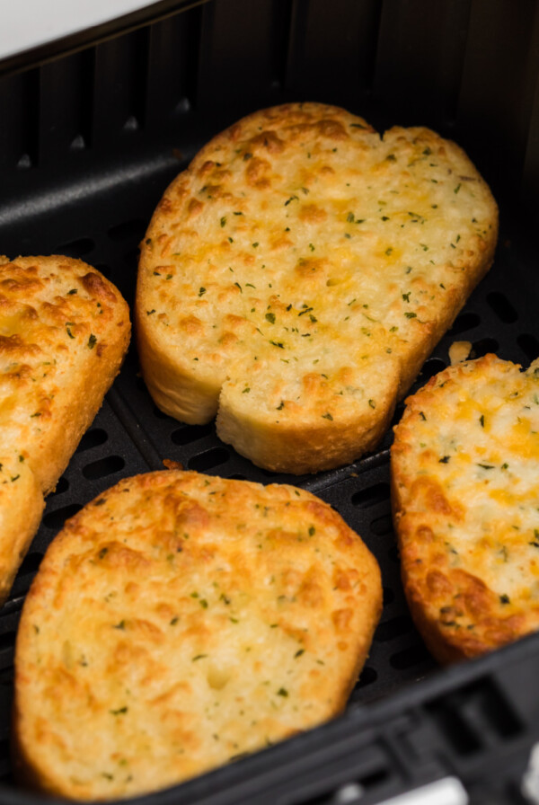 5 cheese texas toast in air fryer basket, ready to serve.