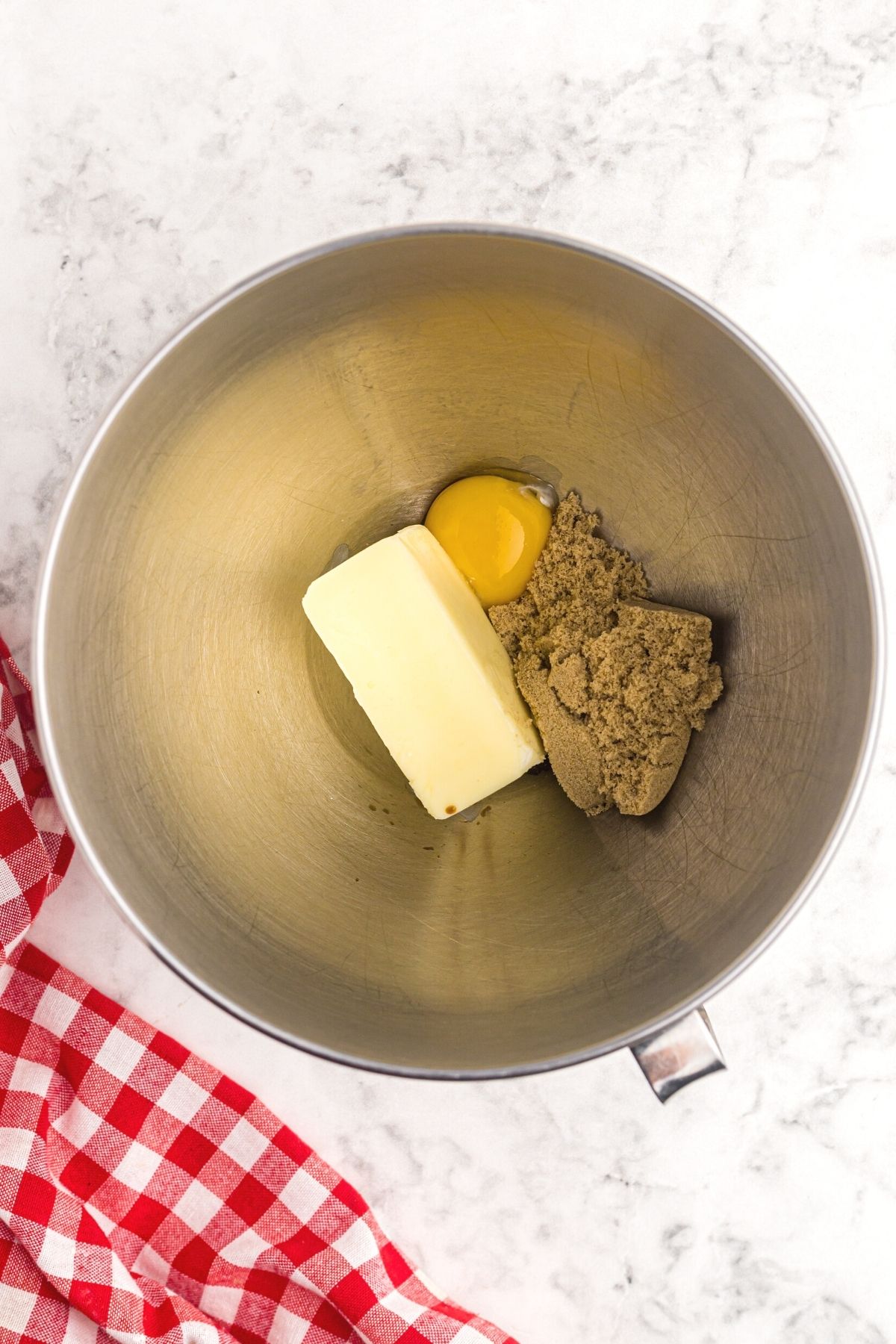 Butter, sugar, egg, and vanilla in a mixing bowl