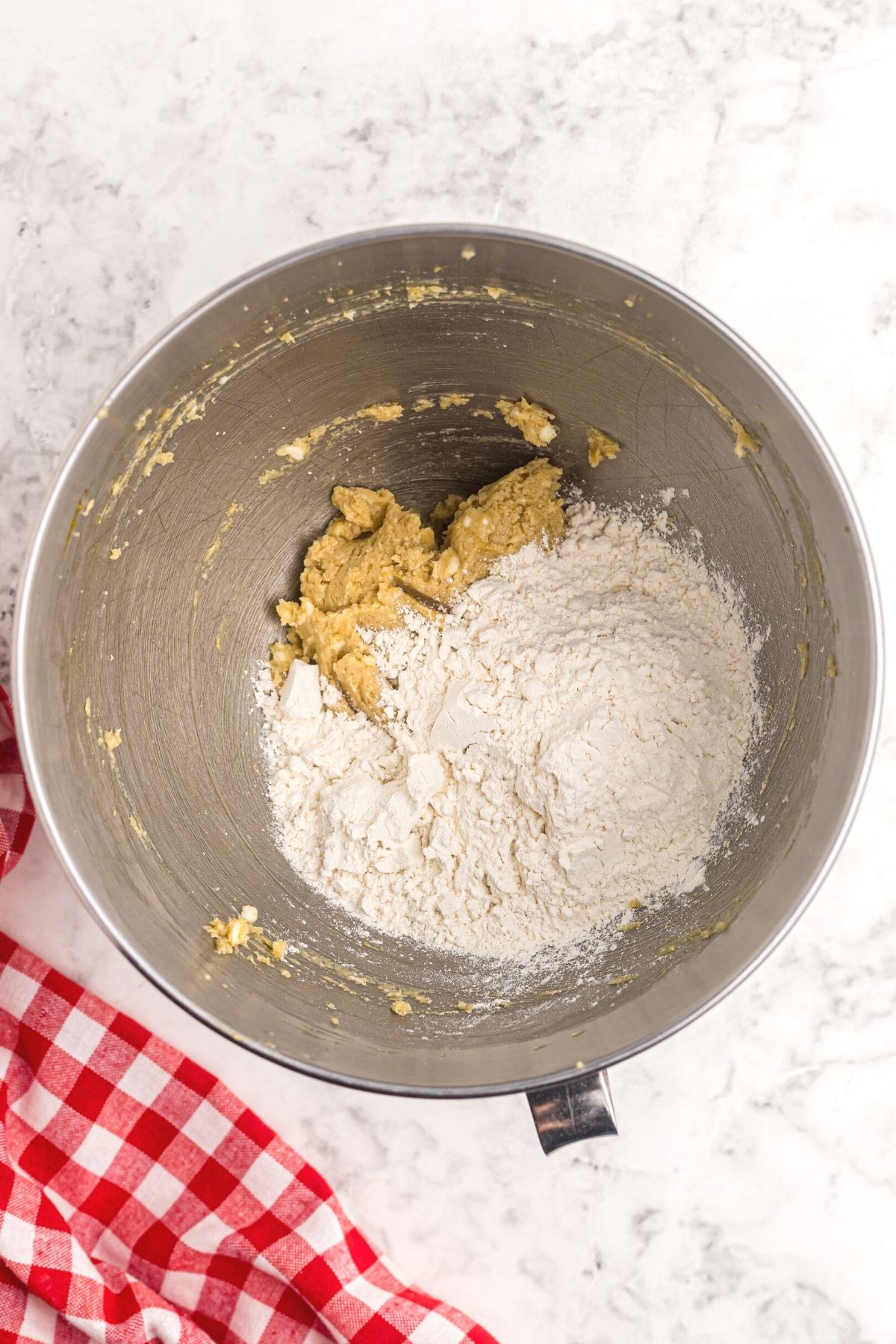Flour added to dough in mixing bowl