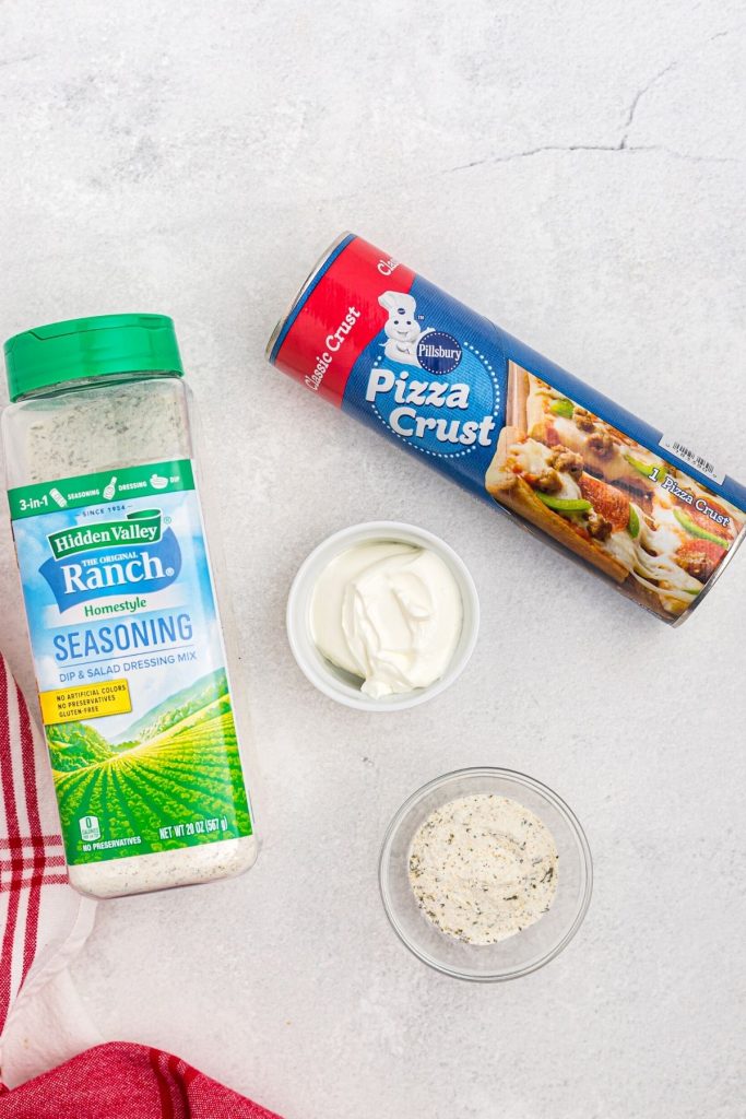 Pizza crust dough, ranch seasoning and sour cream, ingredients needed to make ranch breadsticks