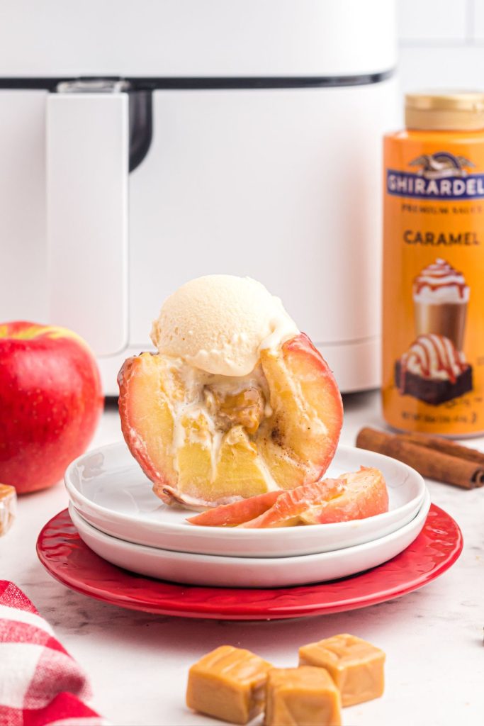 Juicy sliced apple filled with caramel and topped with ice cream