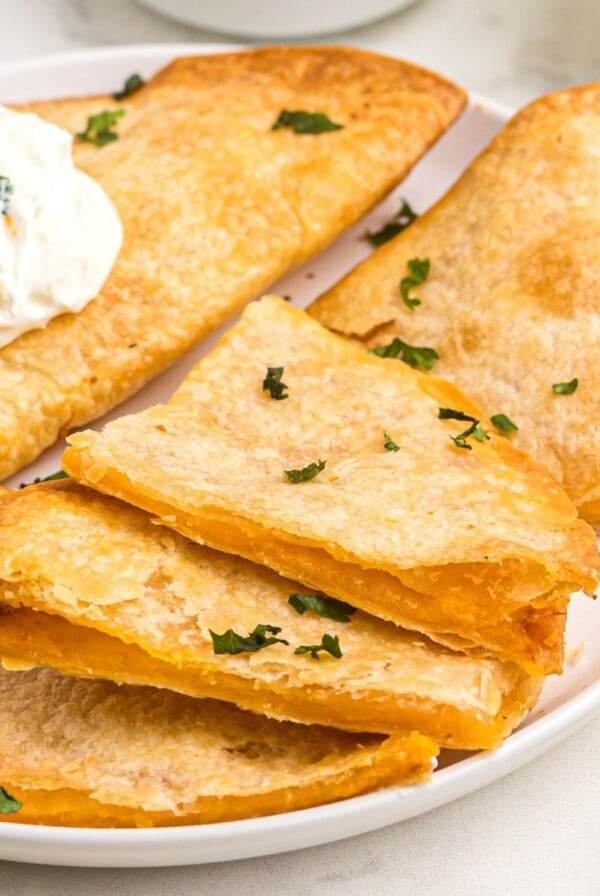 Golden crispy tortillas filled with cheese to make quesadillas