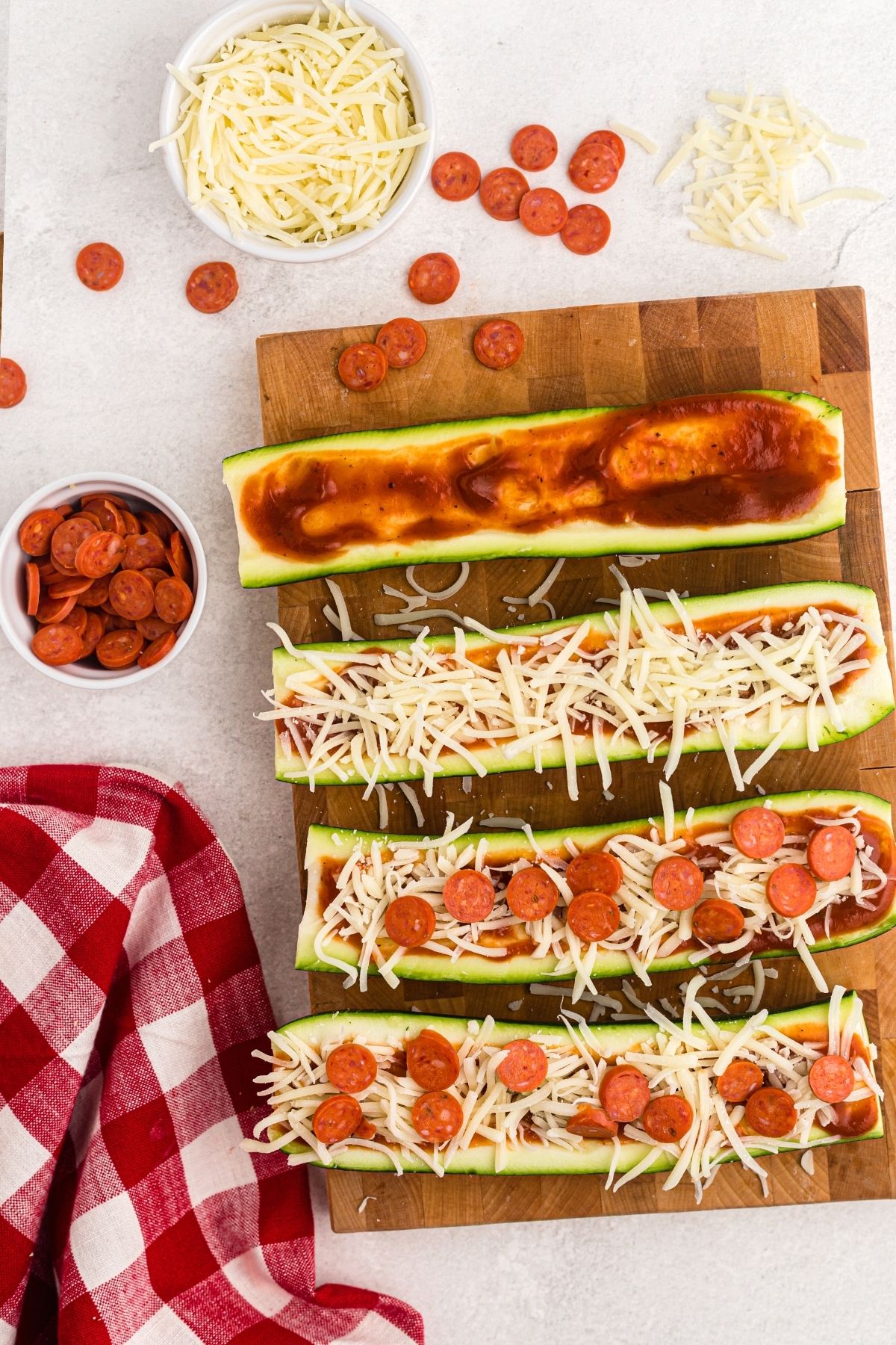 Zucchini cut into slices and topped with cheese, sauce, and pepperonis