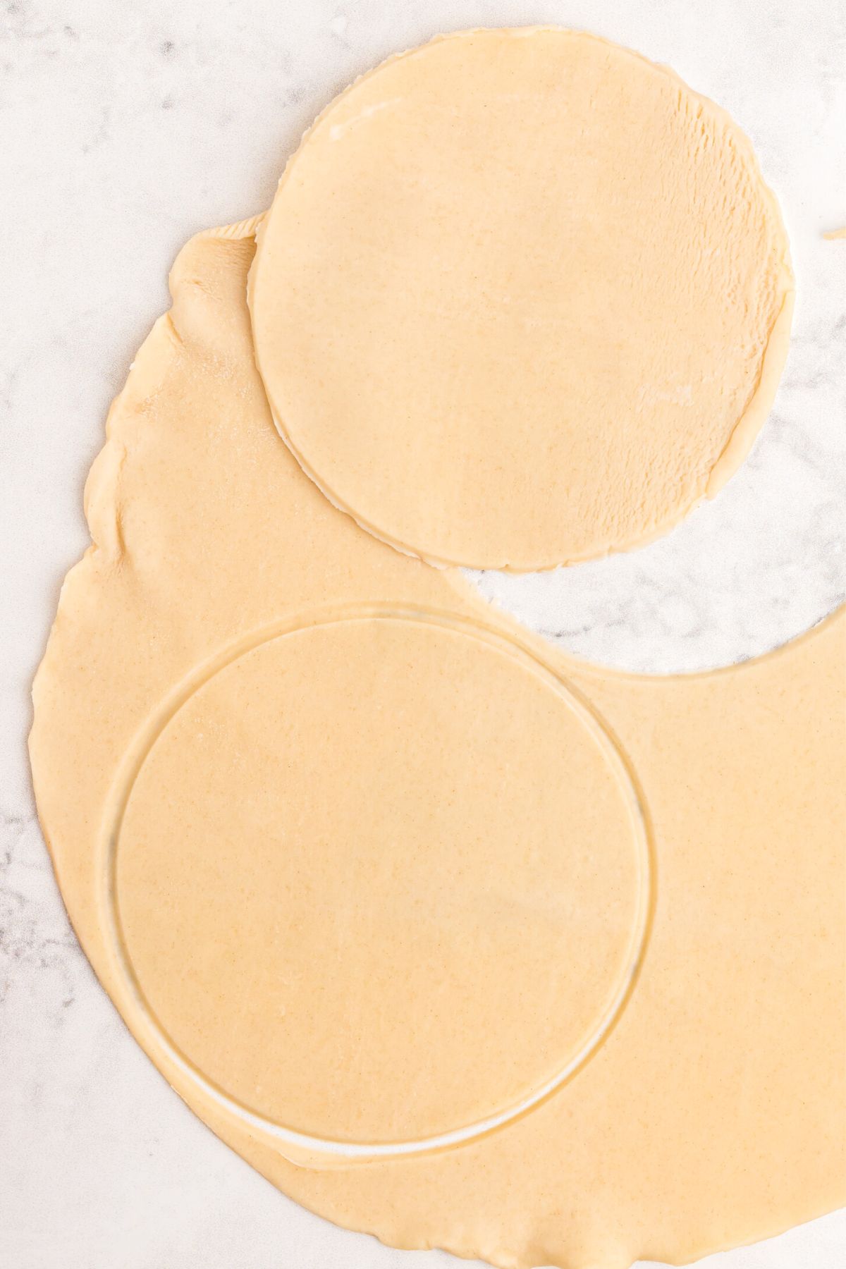 Rolled out pastry dough cut into small circles