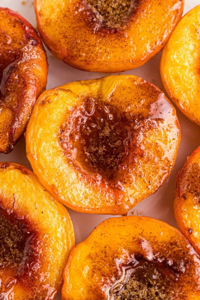 Juicy close up photo of air fried peaches dripping with melted butter