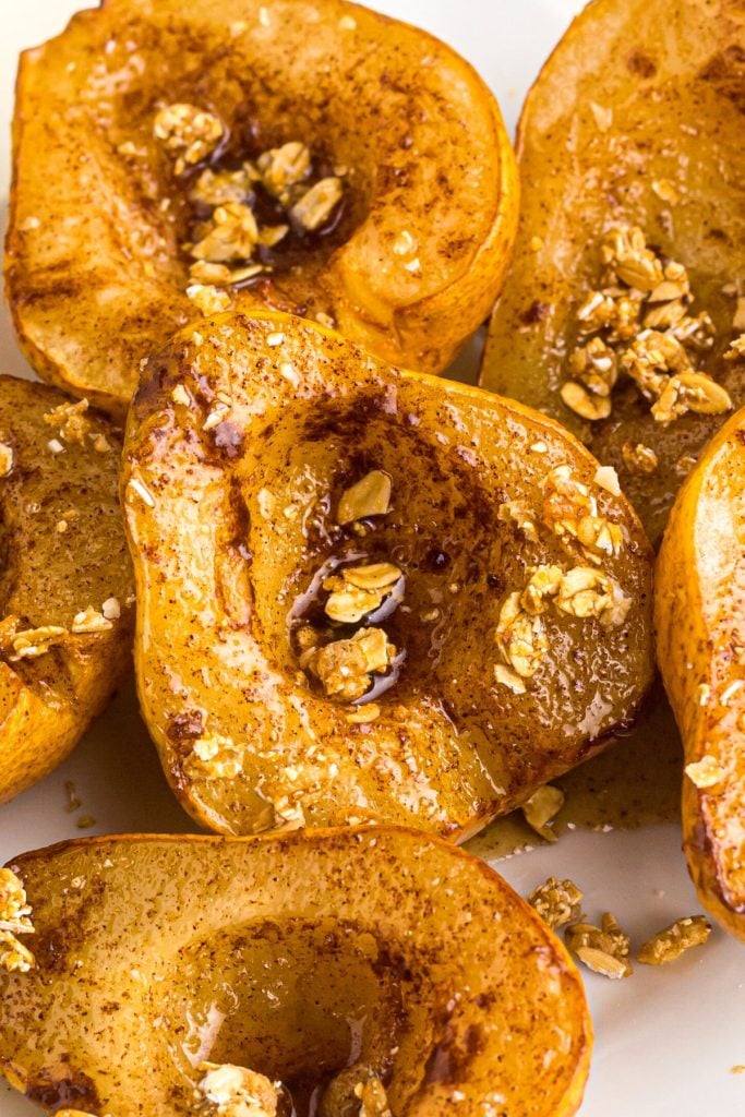 Juicy golden pears on a white plate after being air fried.