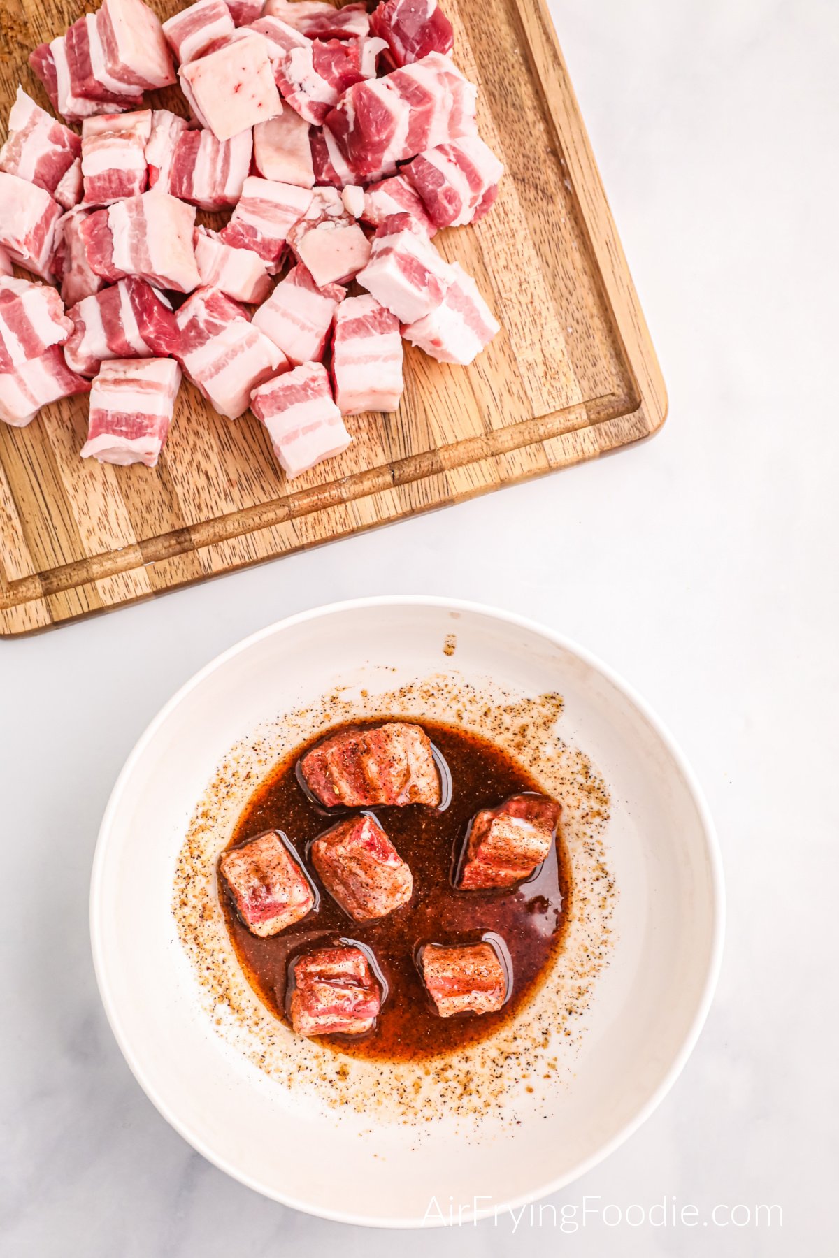 Pork belly bites cut into cubes and tossed in olive oil and seasonings.