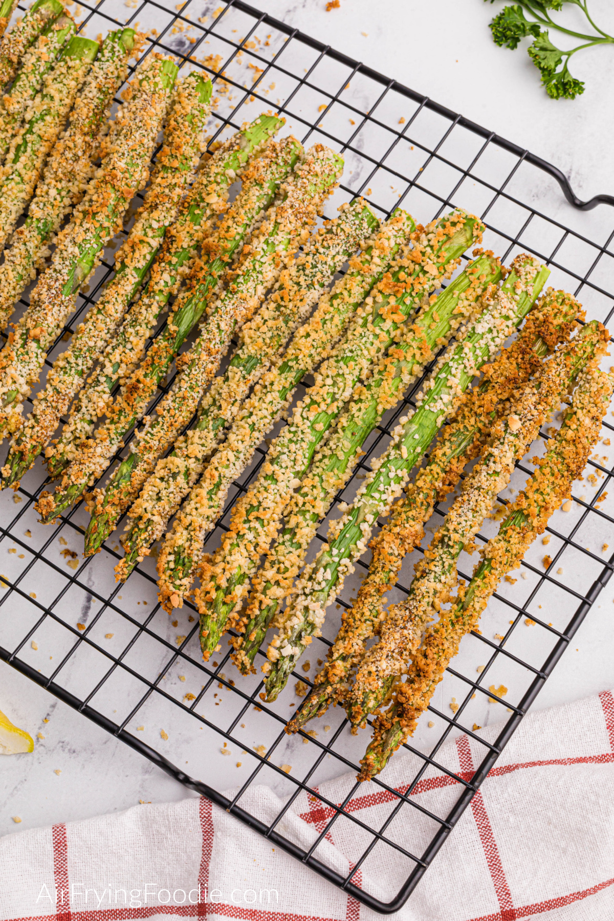 air fried asparagus fries on a cooling rack. 