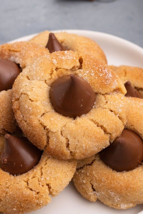 Golden peanut butter cookies on a white plate