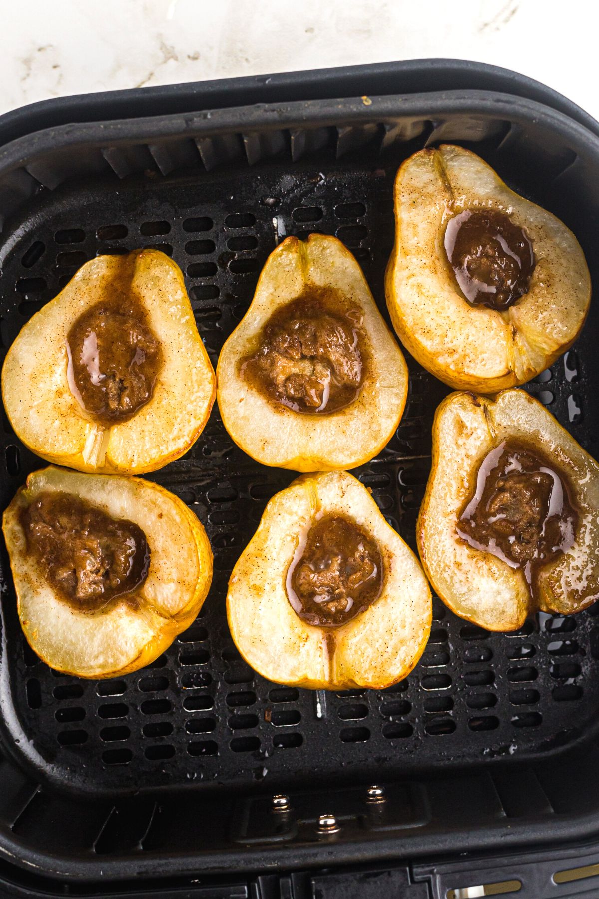 Pears turned face up in the air fryer basket