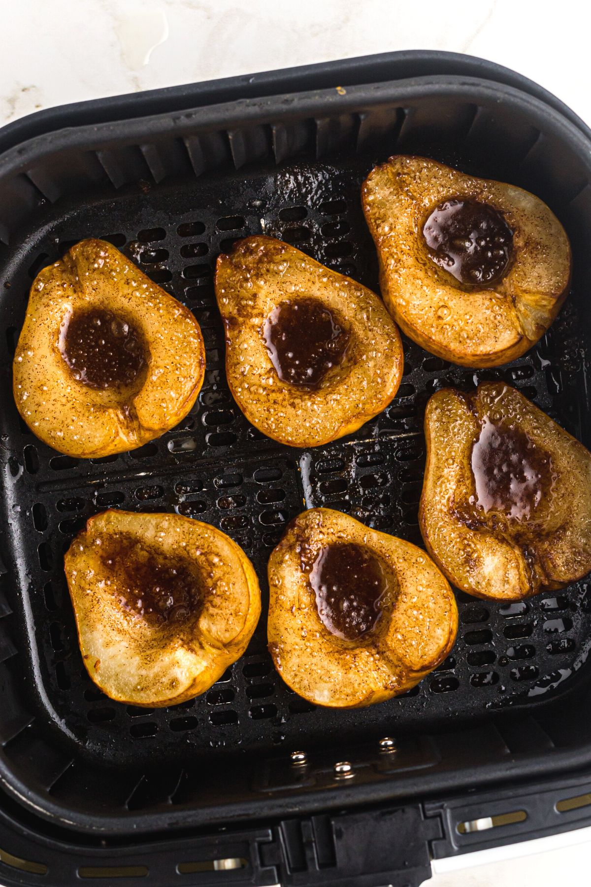 Juicy sliced pears with brown sugar and cinnamon mixture melted inside