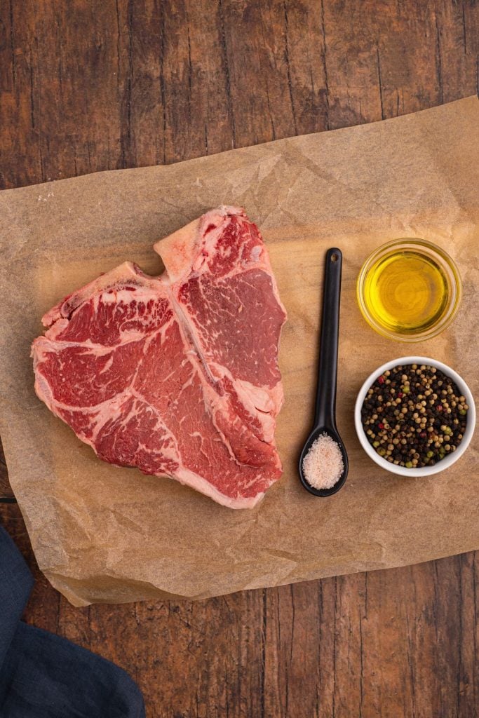 Ingredients needed to make tbone steak in the air fryer- steak pepper, salt, and oil