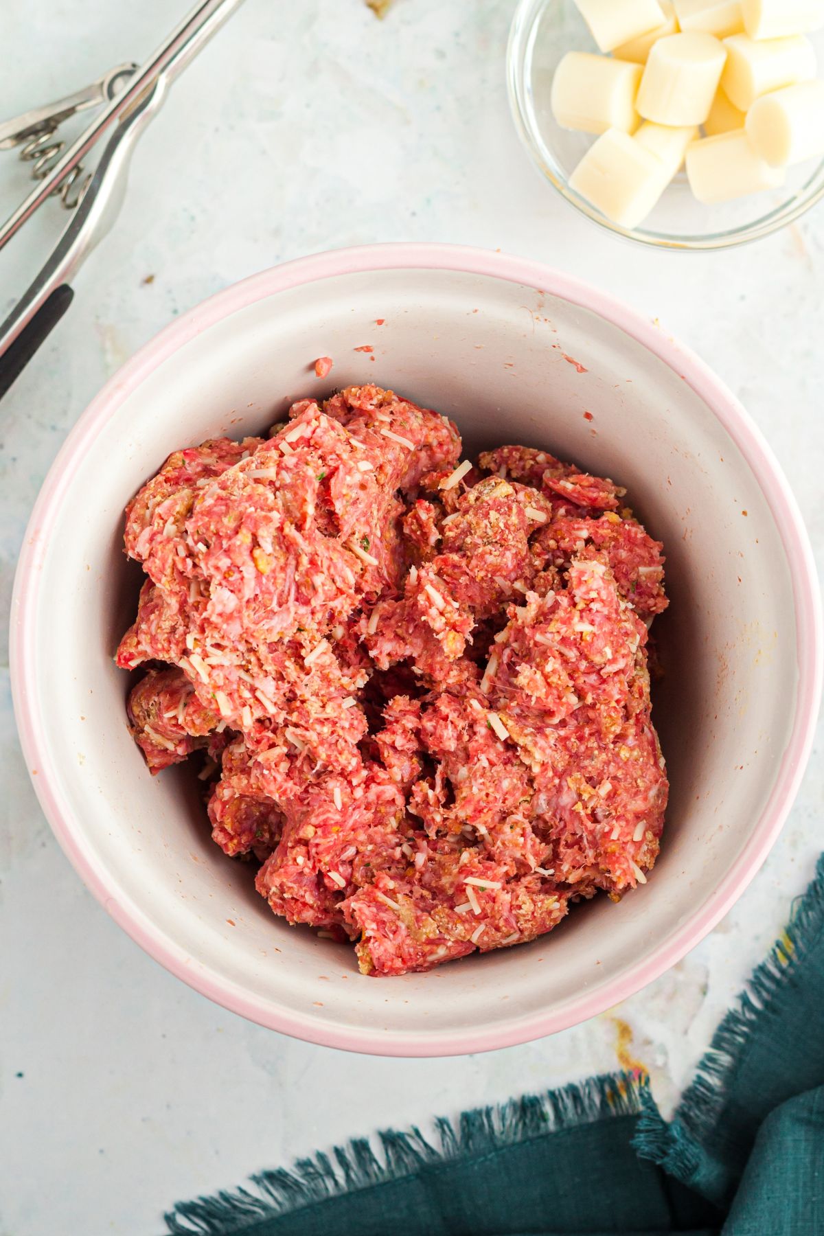 Ground beef combined with seasonings and breadcrumbs