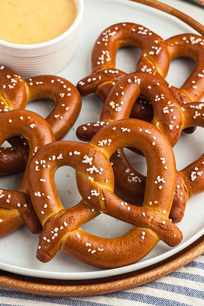 Golden brown pretzels on a white plate 