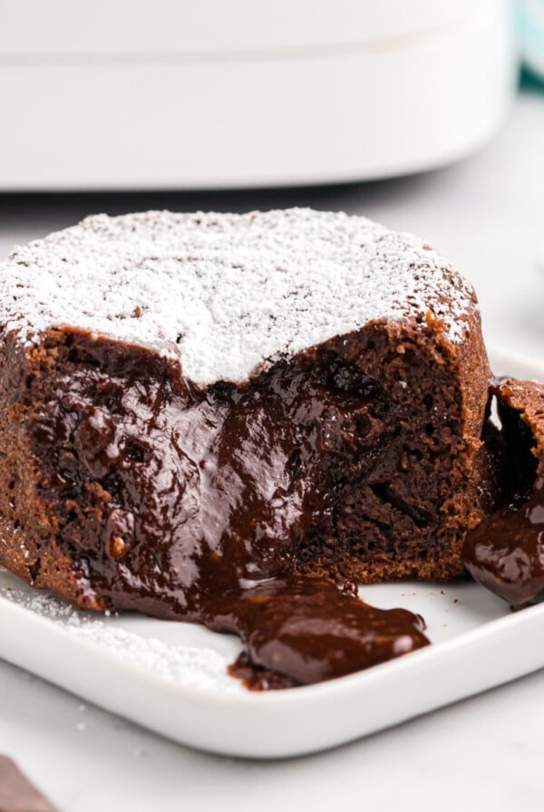 Lava cake bite shot on a white plate.