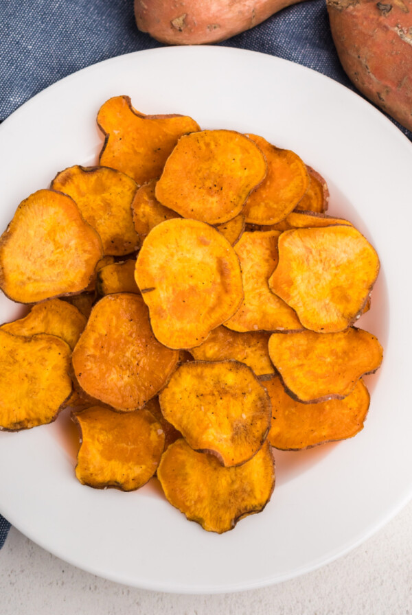 overhead photo of air fryer sweet potato chips in a white bowl.