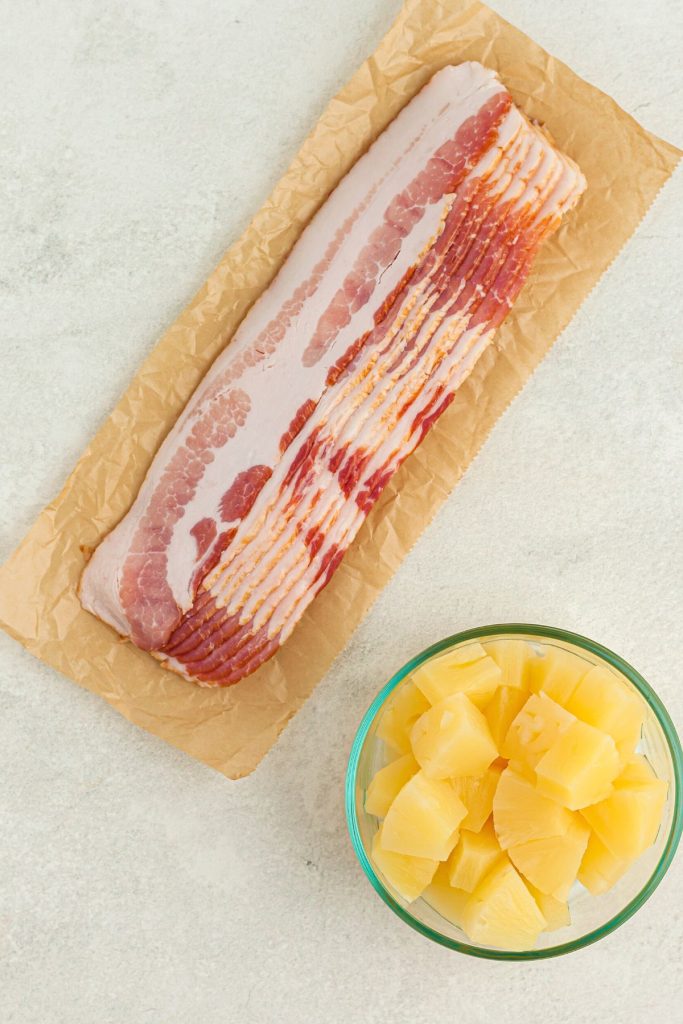 Bacon and pineapple on a white marble table