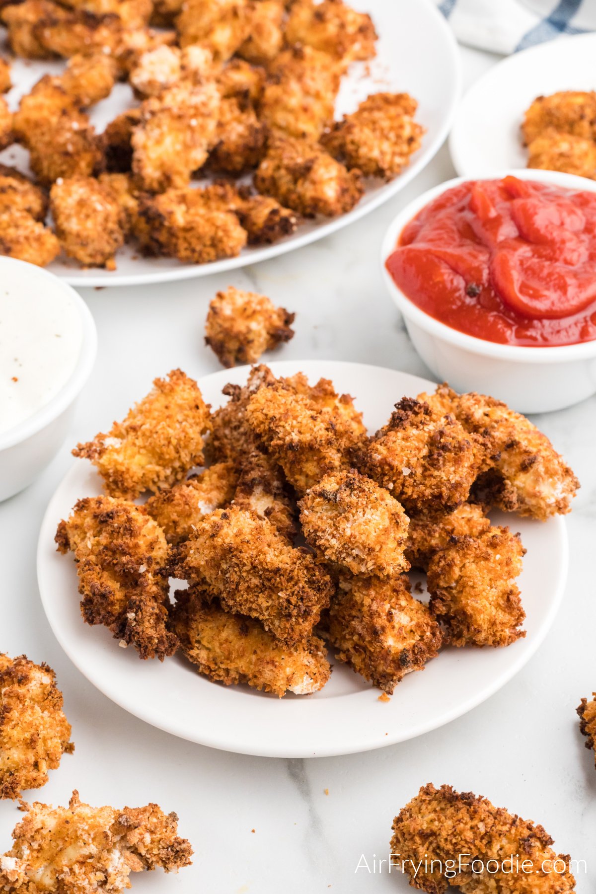 Popcorn chicken on a plate, ready to eat. 