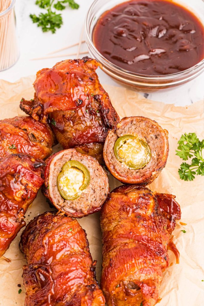 Juicy bacon and sausage wrapped stuffed jalapenos coated with bbq sauce.