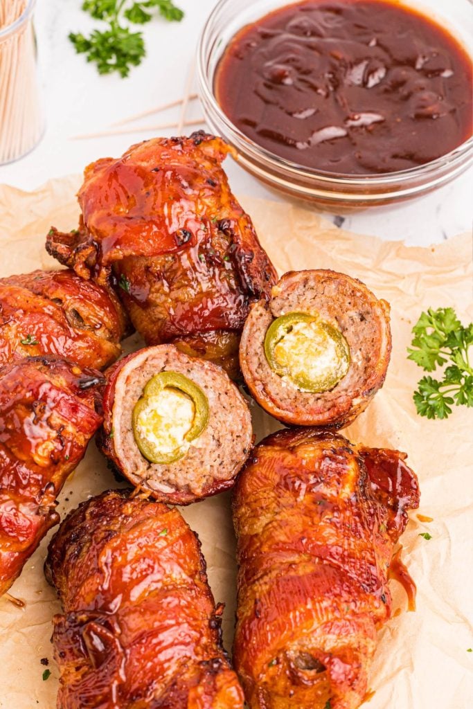 Juicy bacon and sausage wrapped stuffed jalapenos coated with bbq sauce.