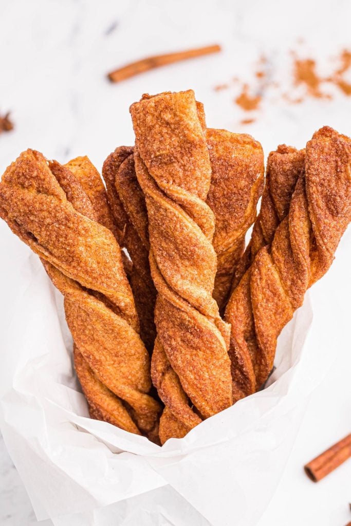 Golden crispy cinnamon and sugar coated twists of air fried dough