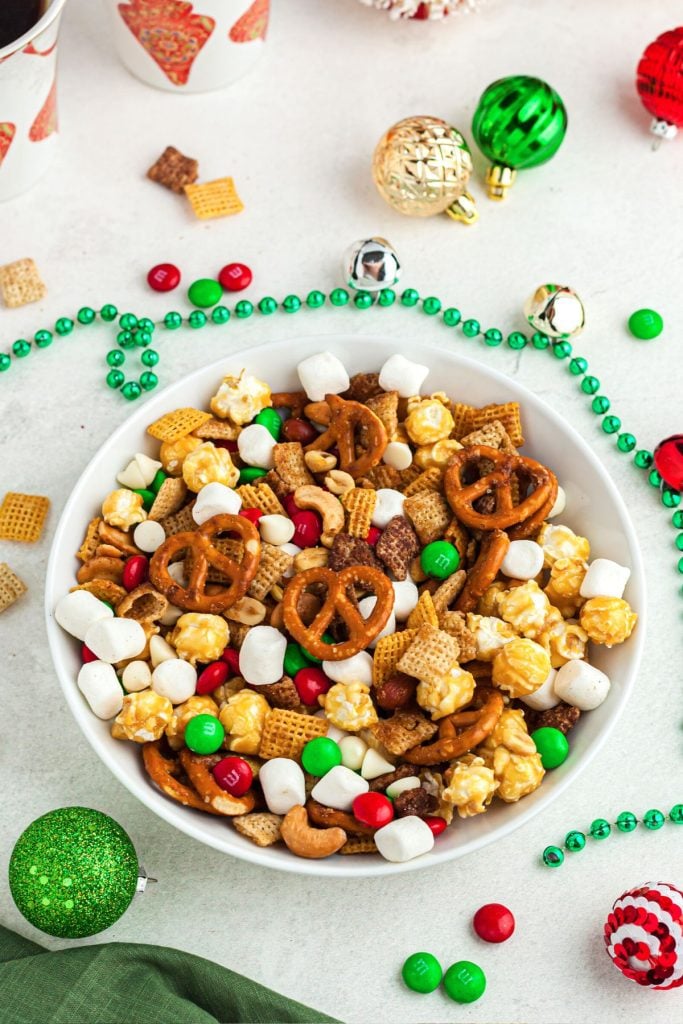 Pretzels, marshmallows, candies and nuts mixed in a white bowl after being air fried