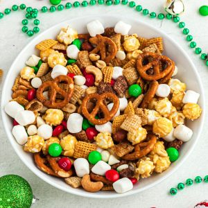 Chex mix with pretzels and nuts in a round bowl