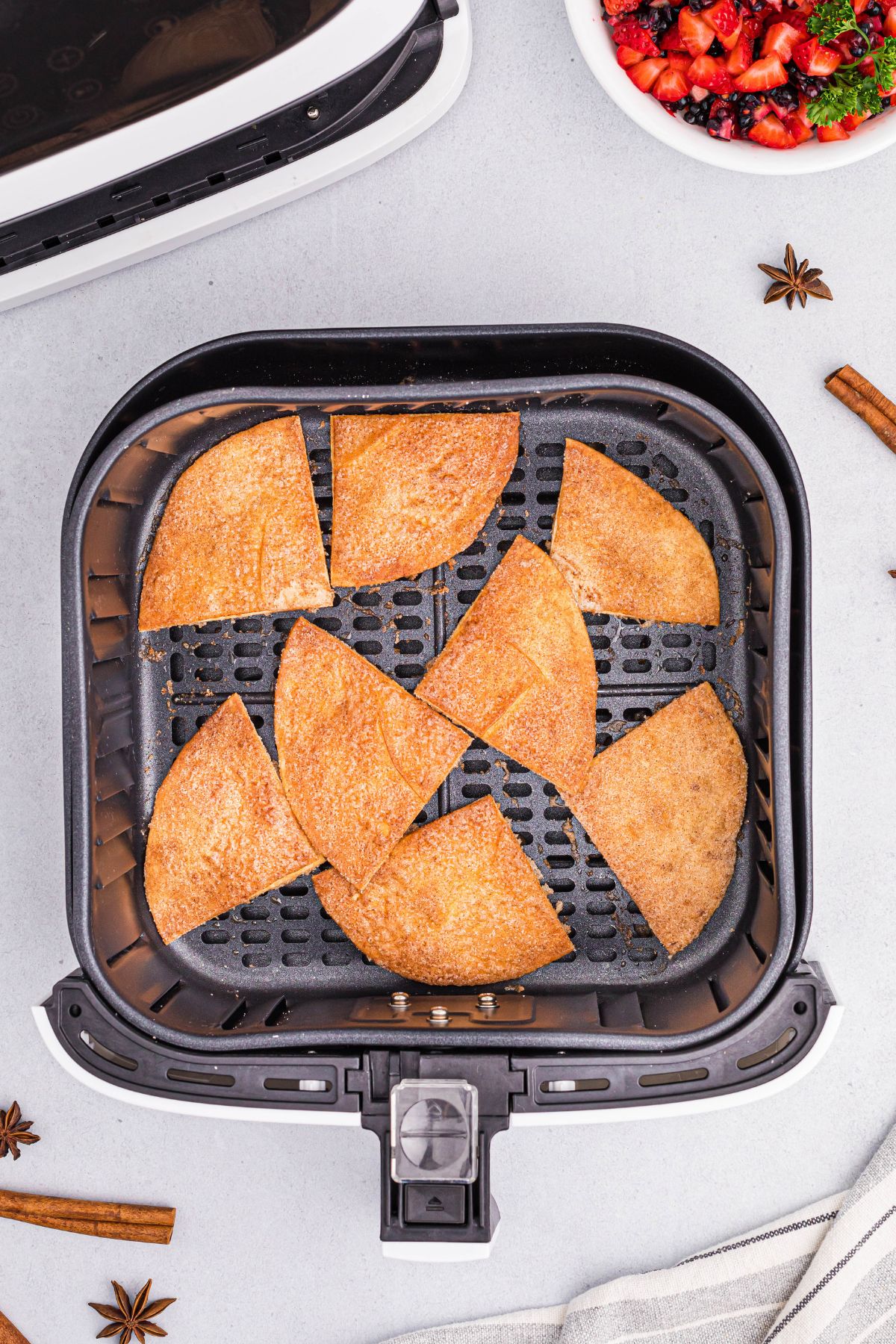 Golden crispy tortilla chips in the air fryer basket