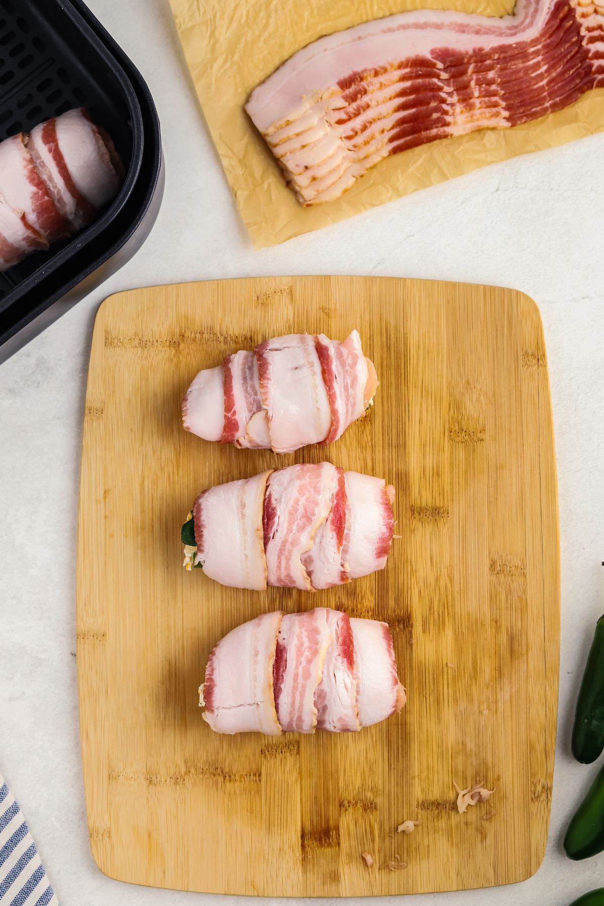 Bacon wrapped chicken breasts over jalapenos