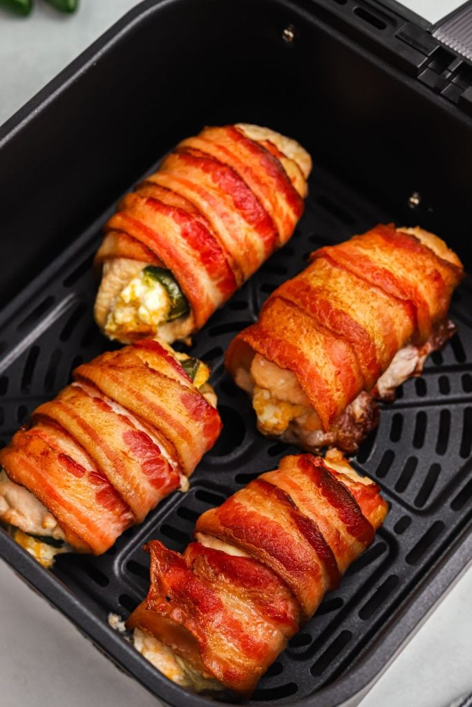 Crispy golden bacon wrapped around chicken breasts stuffed with jalapenos and cheese
