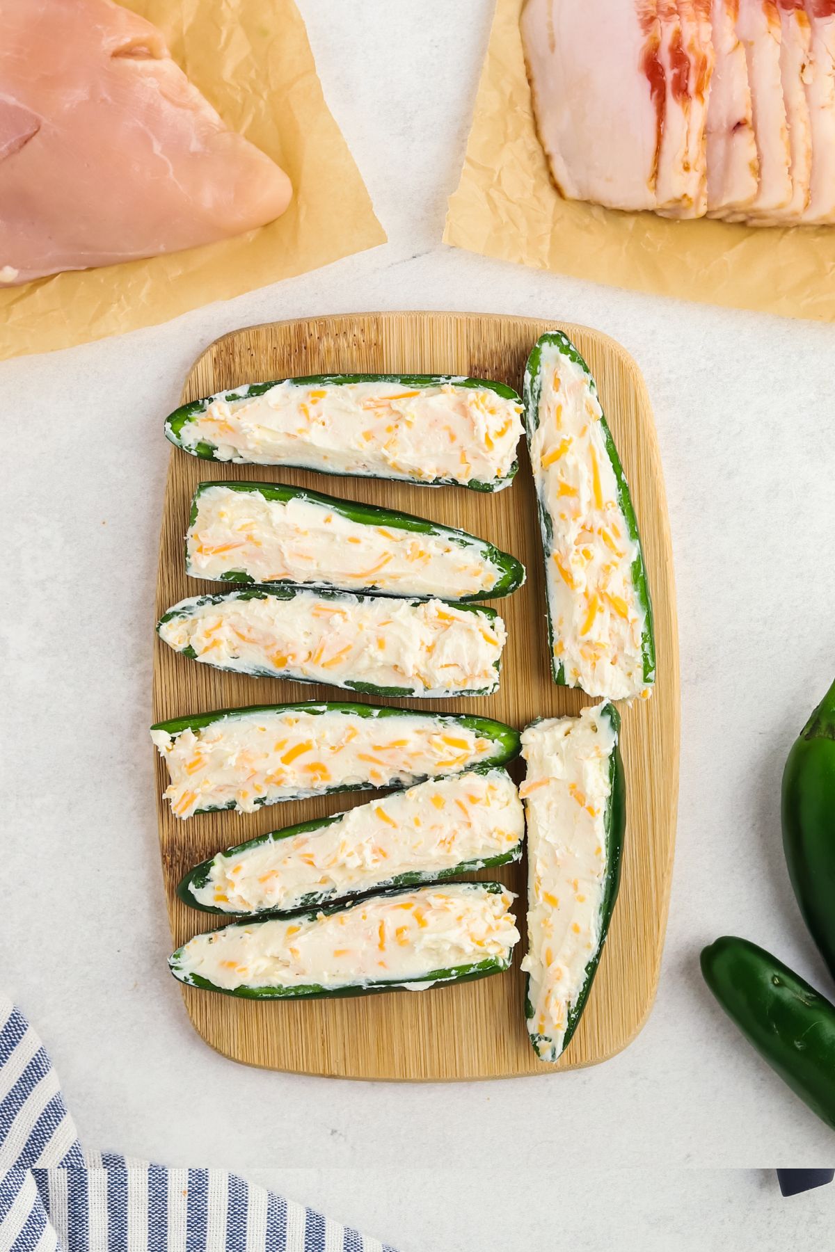 Jalapenos sliced in half then filled with cheese mixture