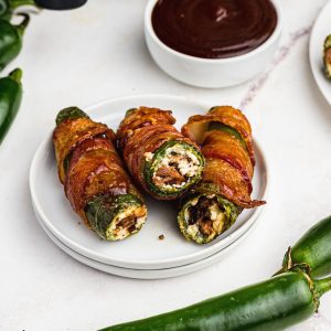 Bacon wrapped jalapenos stuffed with brisket and cream cheese
