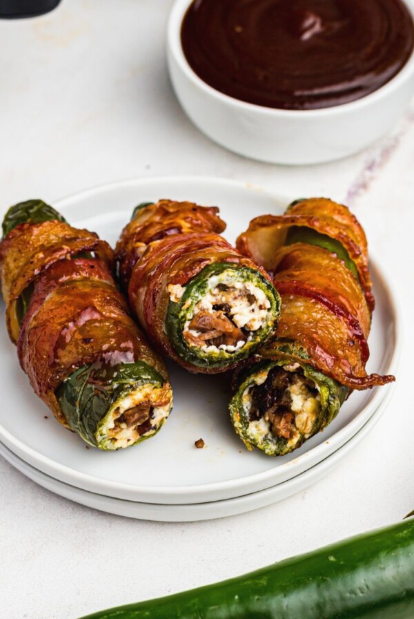 Bacon wrapped jalapenos stuffed with brisket and cream cheese