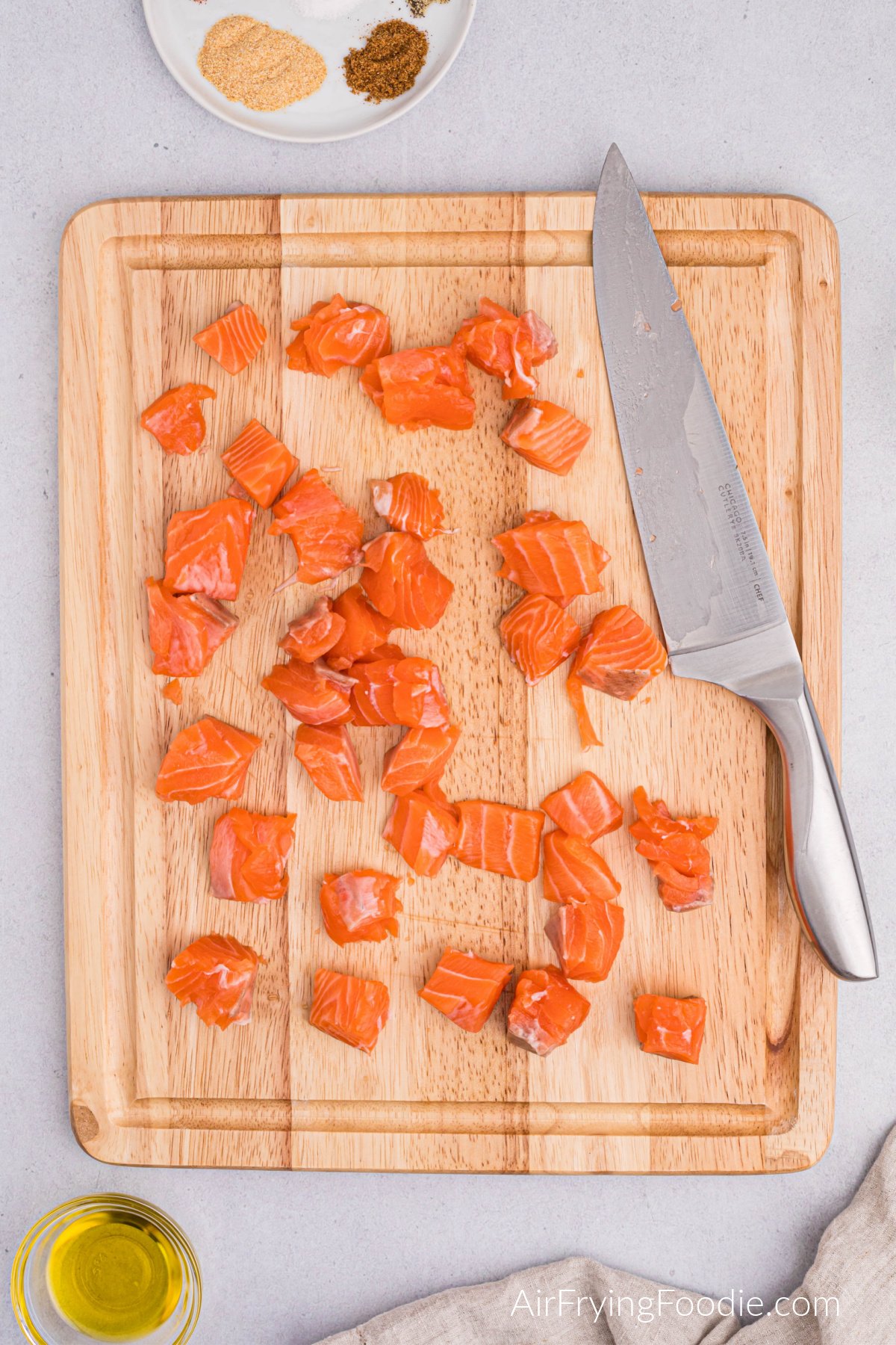 Salmon filets cut into bite sized pieces.