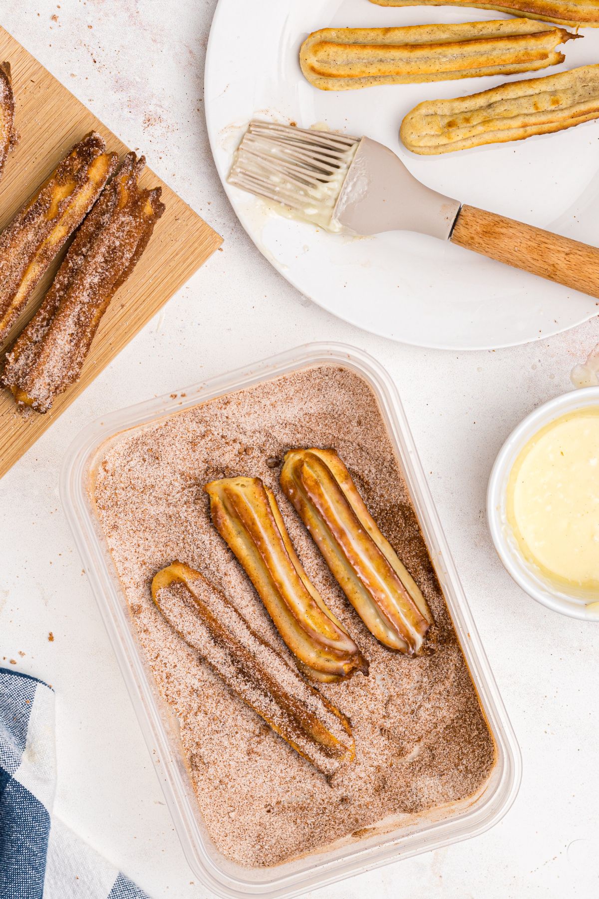 Churros brushed with melted butter and rolled in sugar and cinnamon