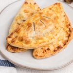 Plate with banana Nutella hand pies stacked and ready to eat.