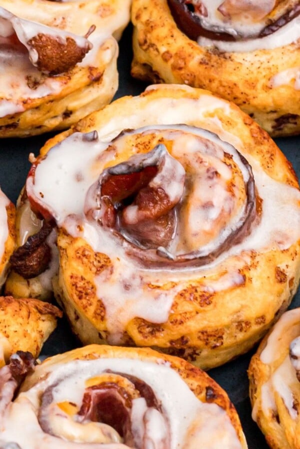 Golden cinnamon rolls air fried around a slice of bacon