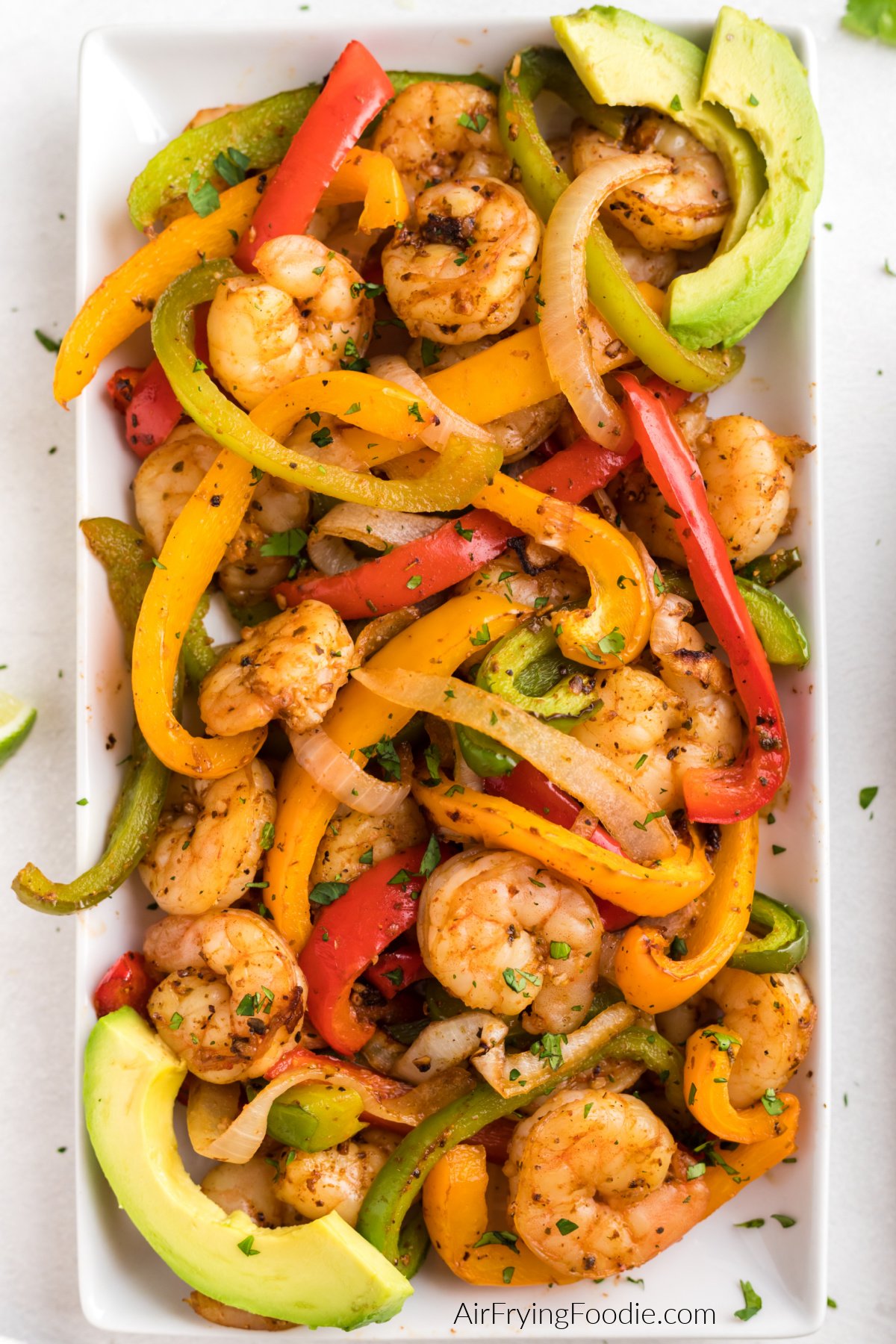 Tray full of shrimp fajitas made with shrimp, onion, and bell peppers  in the air fryer and ready to serve.