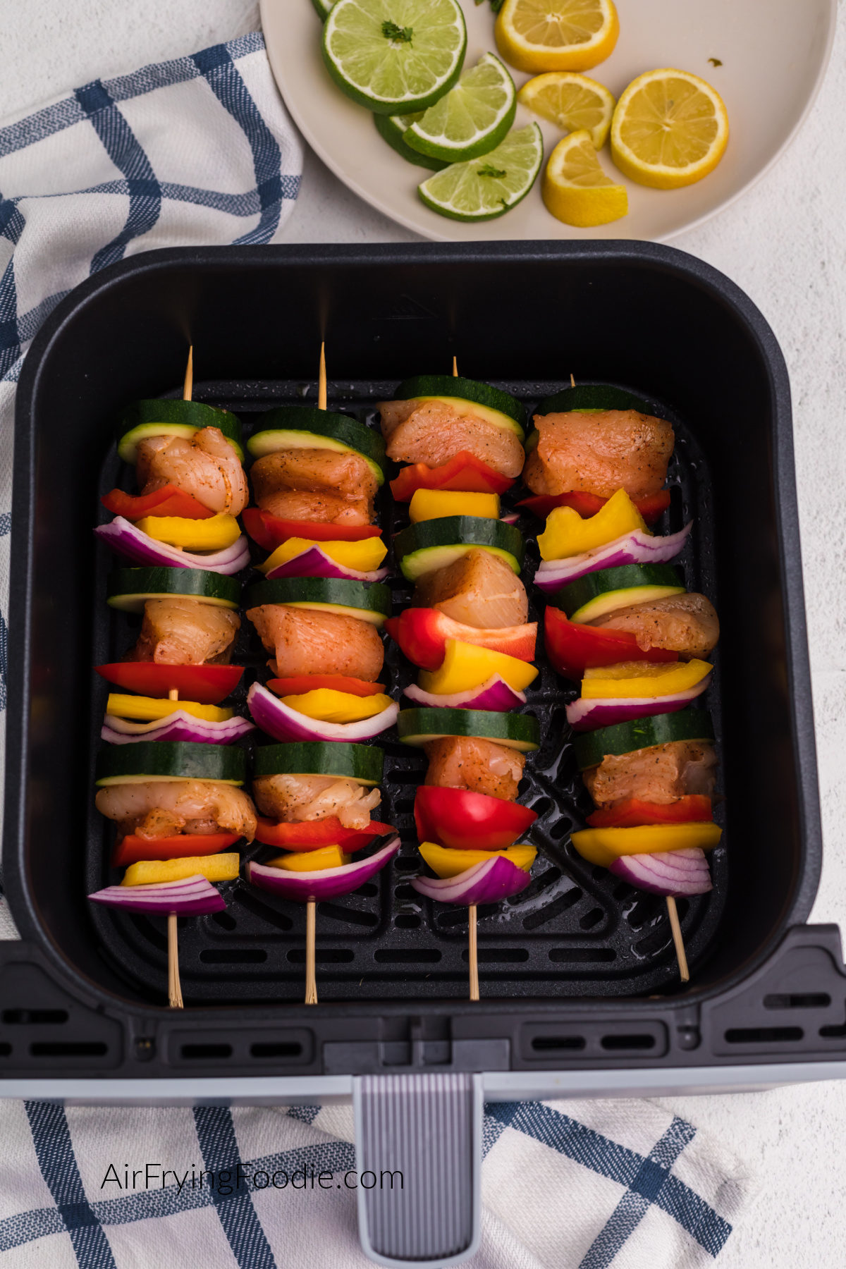 chicken and vegetables rotated on a wooden skewer to make chicken kabobs.
