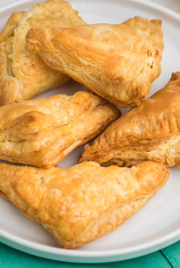 Overhead photo of air fried cream cheese puff pastry on a white plate.