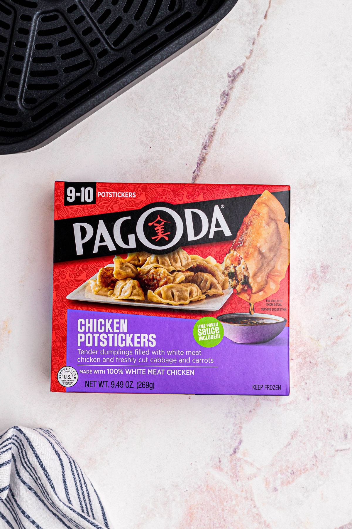 Box of potstickers ready to be placed in the air fryer.