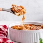 Air fryer Pizza pasta casserole being scooped from the casserole dish.