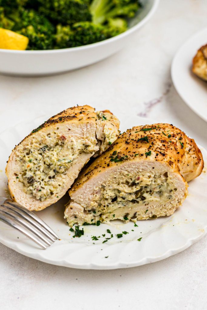 Golden cooked chicken stuffed with basil pesto, cream cheese, and seasonings. 