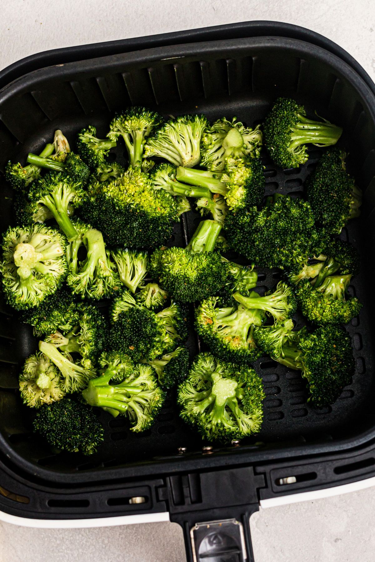 Air fried broccoli in the basket.