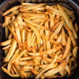 Reheated fries in air fryer basket. Ready to serve.